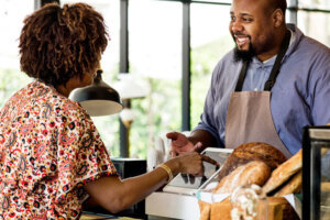 Customer ordering pastry at counter