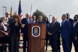 Maryland's elected leaders at all levels stand in front of the entrance to the Greenbelt Metro Station