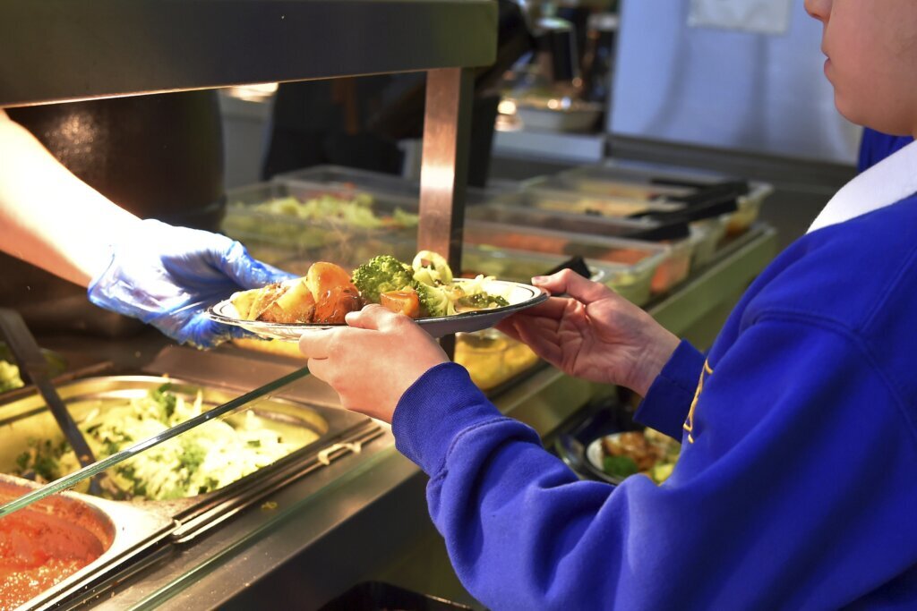 Student handed a hot meal