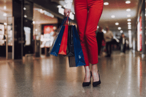 Stylish woman on shopping in airport before flight
