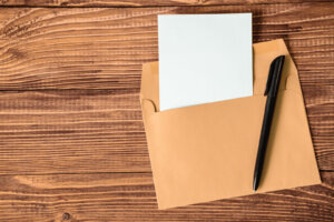 Empty sheet of paper with pen and envelope