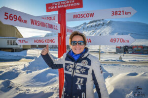 North Pole Marathon Jill at North Pole sign in Svalbard