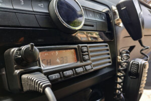 Police patrol car radio equipment and microphone. Walkie talkie. Selective focus.