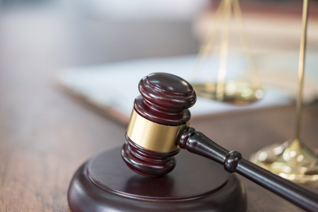 Justice Scales and books and wooden gavel