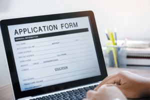 Business man working on laptop computer and application Form Information for the searching job or fill out personal data for online web job the application form. Employment Concept.