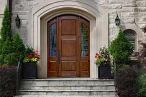 Elegant front door of stone house with flagstone steps