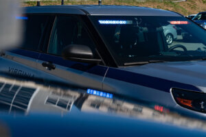 Photo of a Virginia State Police cruiser with flashing emergency lights