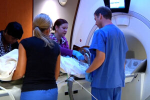 A patient is being placed in an MRI machine.