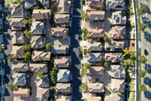 Aerial top view of upper middle class neighborhood with identical residential subdivision houses