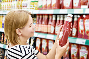 Tomato ketchup in hands woman