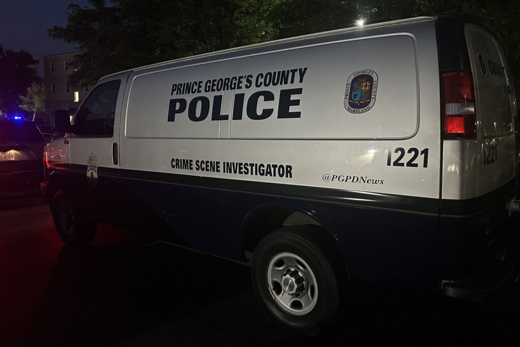 A Prince George's County police van at the site of an early morning shooting