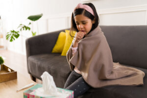 Sad child suffering from the flu