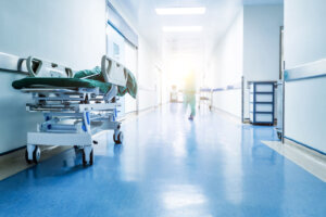 Doctors or nurses walking in hospital hallway, blurred motion