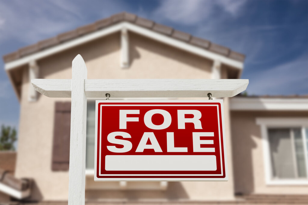 Home For Sale Real Estate Sign and House.