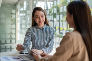 Two Asian Business woman working together. Business Financial concept.