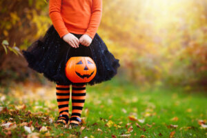 Little girl having fun on Halloween trick or treat
