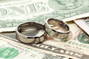 Wedding rings on dollar bills