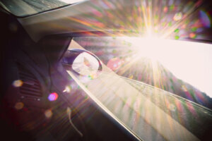 Sun glare on a car window mirror