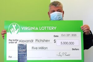 Man holds oversized check