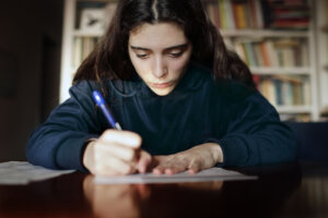 Teenage girl studying in the library