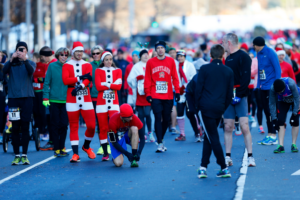 Runners at the 2014 Jingle All the Way street race