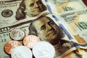 Passive Income Through Stock Dividends With Pennies, Dime & Quarters On One Hundred Dollar Bills High Quality