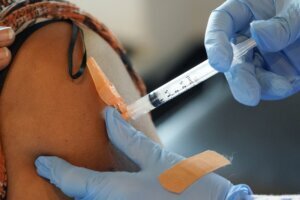 Nurse giving a patient a vaccination