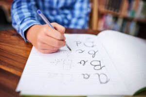 Practising his handwriting