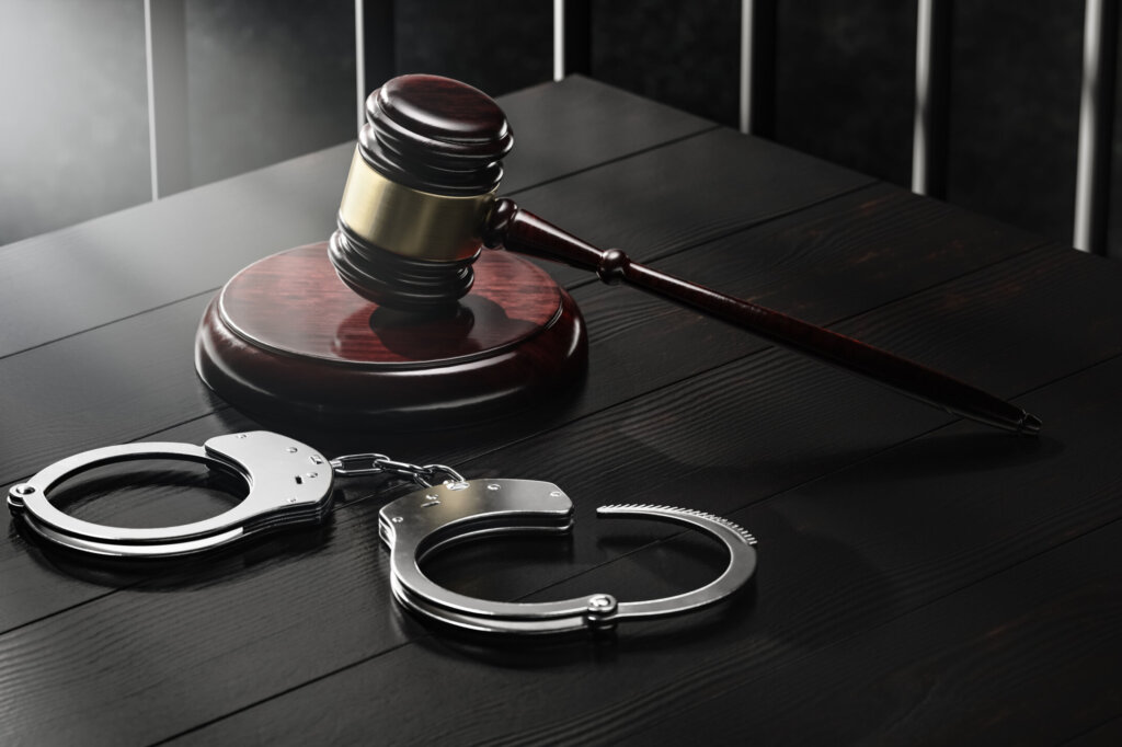Law Legal System Justice Crime concept. Mallet Gavel Hammer and Handcuffs on black background. 3d Render illustration