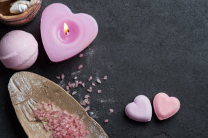 Bath bomb closeup with pink lit candle