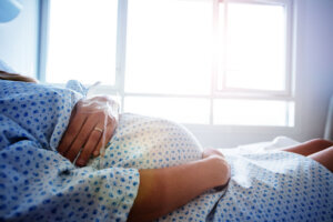 Close up of a pregnant woman's belly in hospital