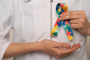 Doctor holding autism awareness ribbon