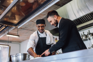 Two male workers in a kitchen