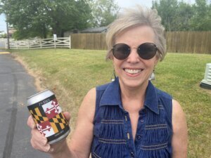 Terry Hinds with a can of beer from Calvert Beer Company.