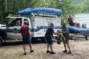 Crews and boats along the water