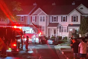 Fire engines in front of town houses.