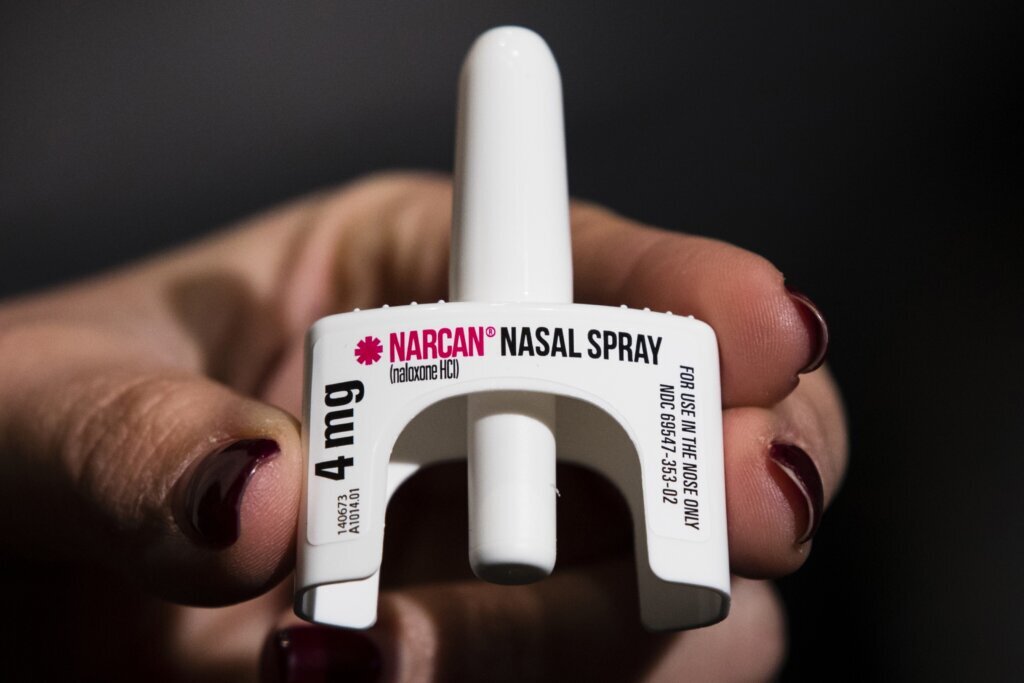 Hand holding the overdose reversal drug Narcan.