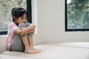 Young girl, alone on the floor