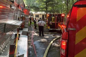 Fire engine on scene of house fire.