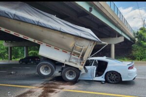 Dumpster truck crashes into bridge support on I
