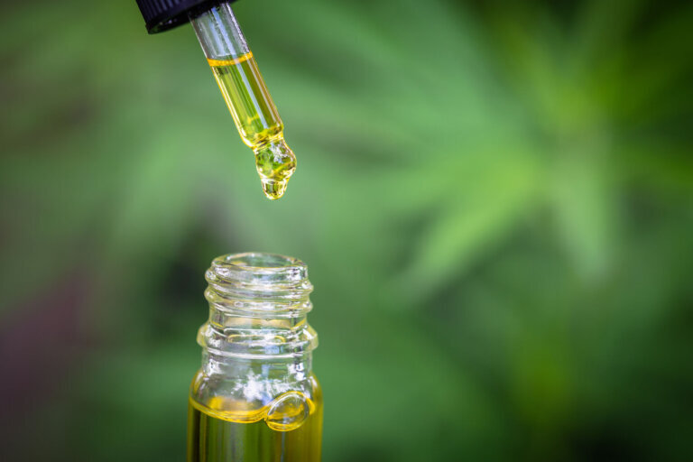 Droplet dosing a biological and ecological hemp plant herbal pharmaceutical, cbd cannabis oil.
