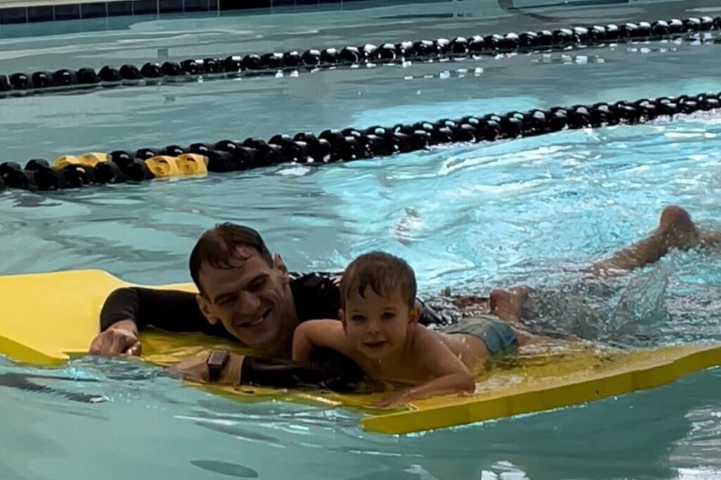 Peter Lord teaching a swimmer