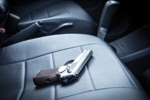 The gun is on the car seat. criminal district of the city