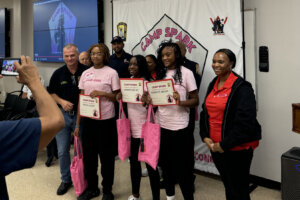 Girls smiling with certificates