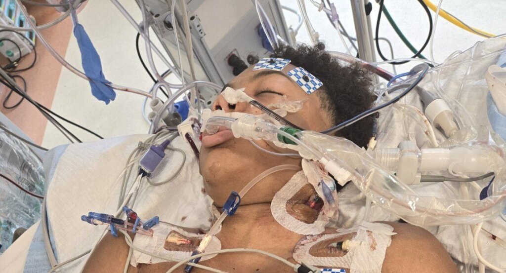 Chase Lancaster seen in the hospital after being shot.