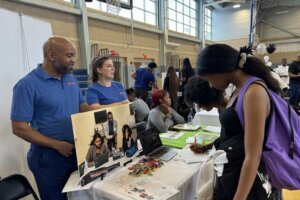 People at an after school programs fair.