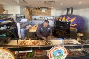 Carlos Gonzalez makes pizza
