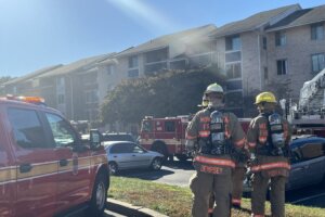 Two firefighters outside house fire in Montgomery County
