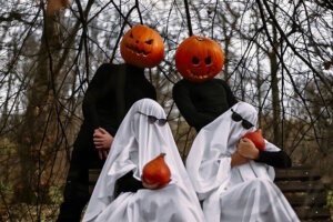 Halloween pumpkins and ghosts in the forest