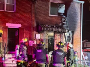 Firefighters on the scene of townhouse fire
